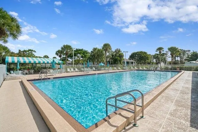 a view of swimming pool with a lake view