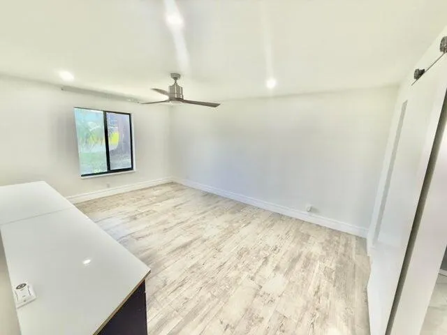 wooden floor in a room with a window