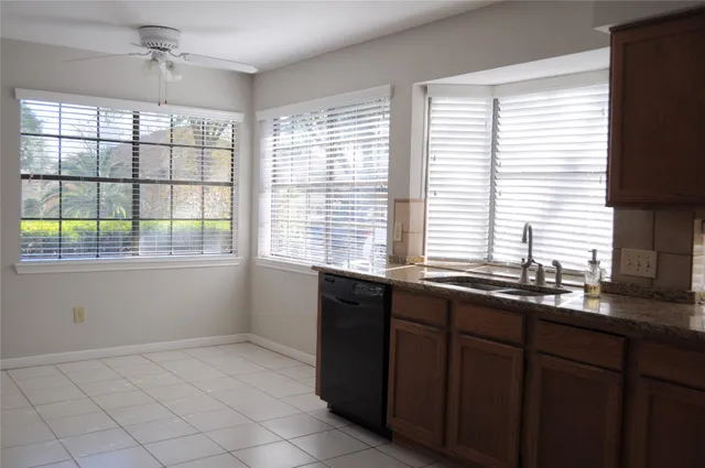 a kitchen that has a stove and a microwave