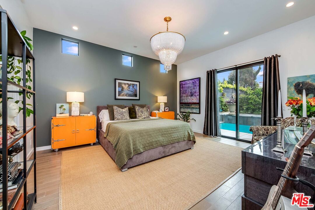 7407 Earldom Avenue Playa del Rey, CA 90293 - Photo 23 of 56 a bedroom with a large bed and a large window