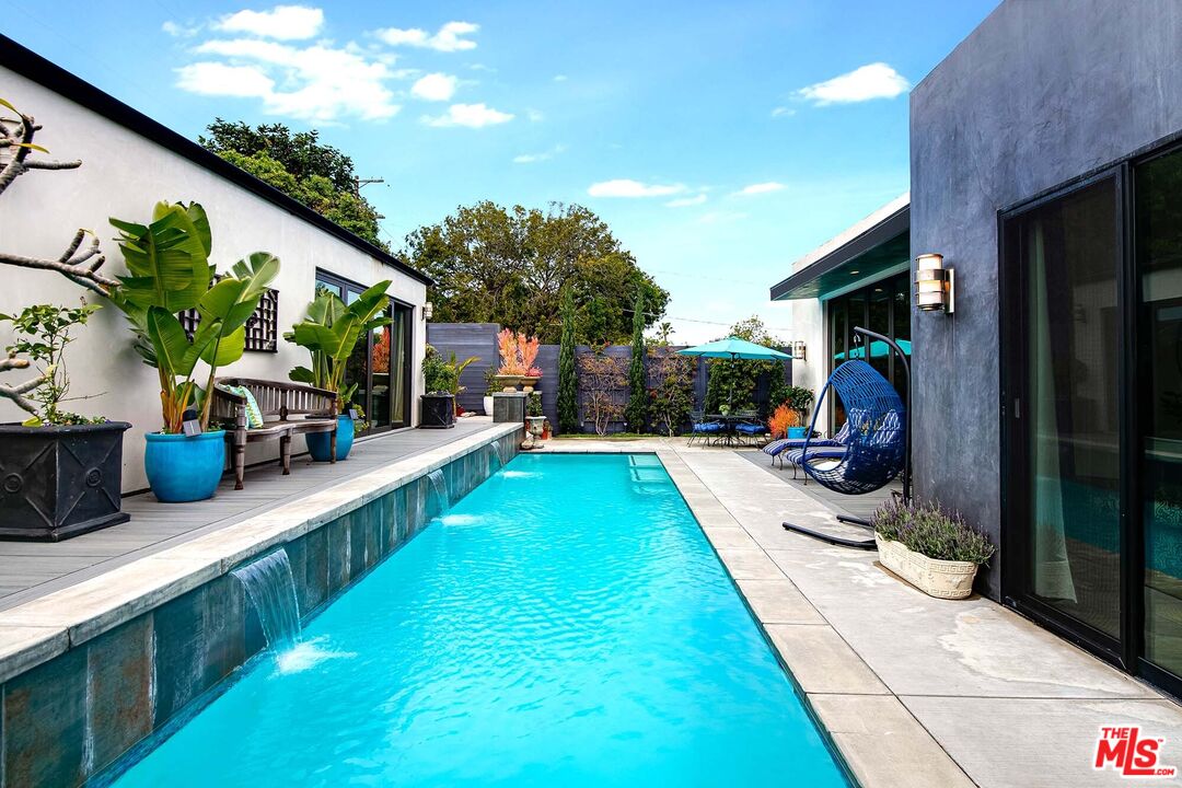 7407 Earldom Avenue Playa del Rey, CA 90293 - Photo 36 of 56 a swimming pool with outdoor seating and yard
