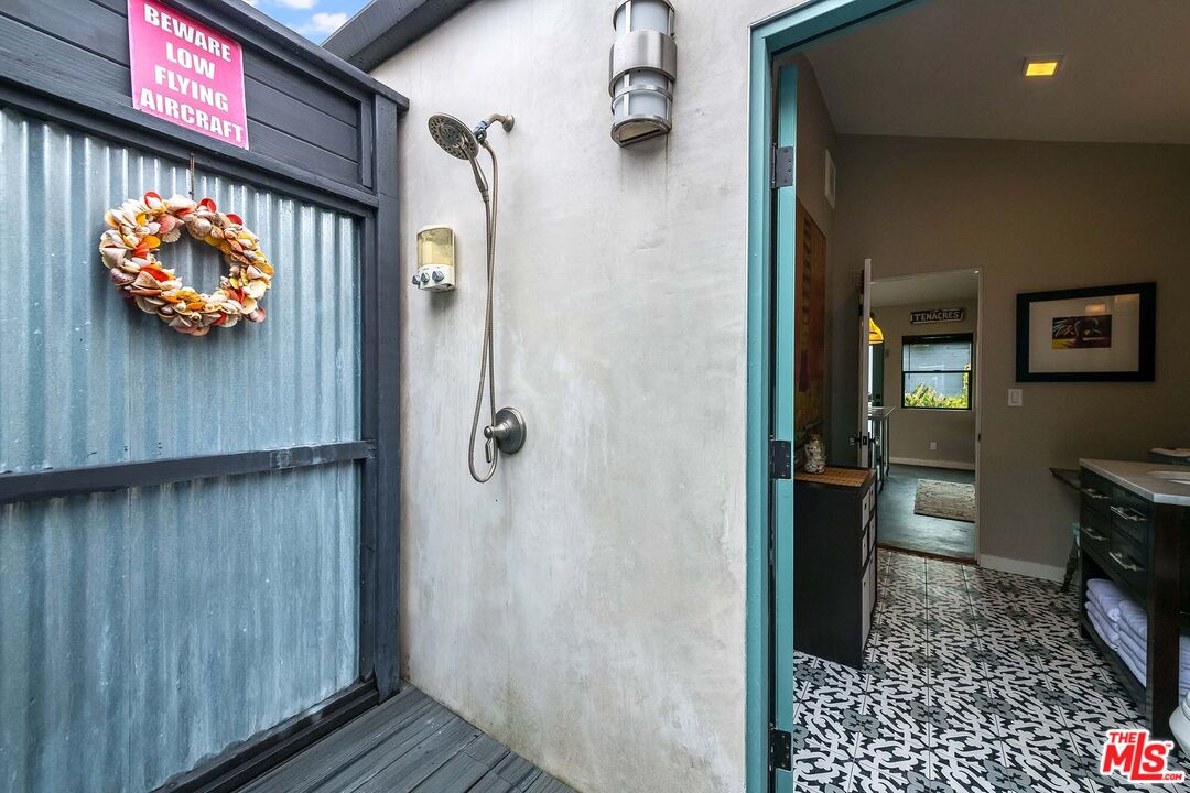 7407 Earldom Avenue Playa del Rey, CA 90293 - Photo 46 of 56 a view of a hallway with wooden shelves