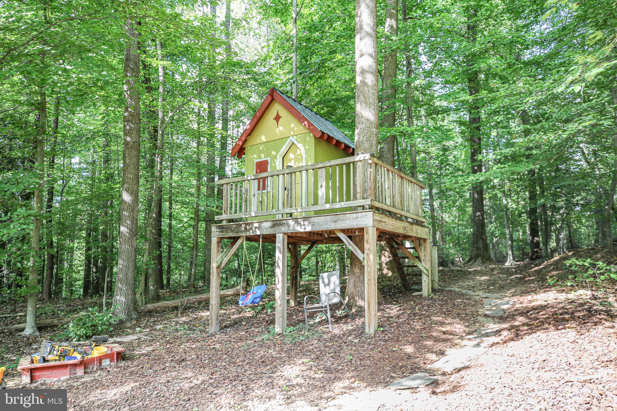 10108 Willow Ridge Lane Spotsylvania, VA 22553 - Photo 13 of 61 a view of a small house in the forest