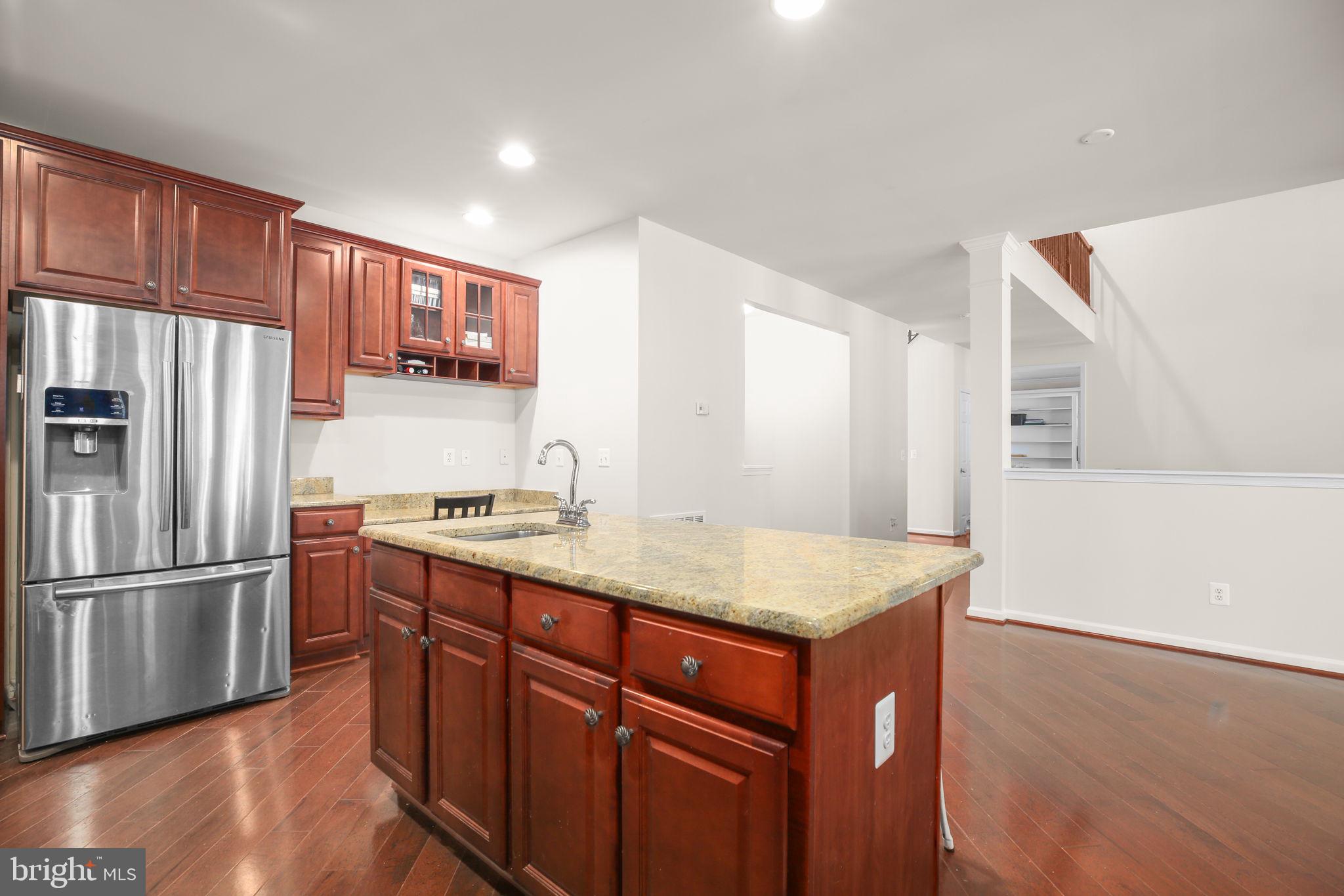 10108 Willow Ridge Lane Spotsylvania, VA 22553 - Photo 20 of 61 a kitchen with stainless steel appliances granite countertop a refrigerator a sink and a stove