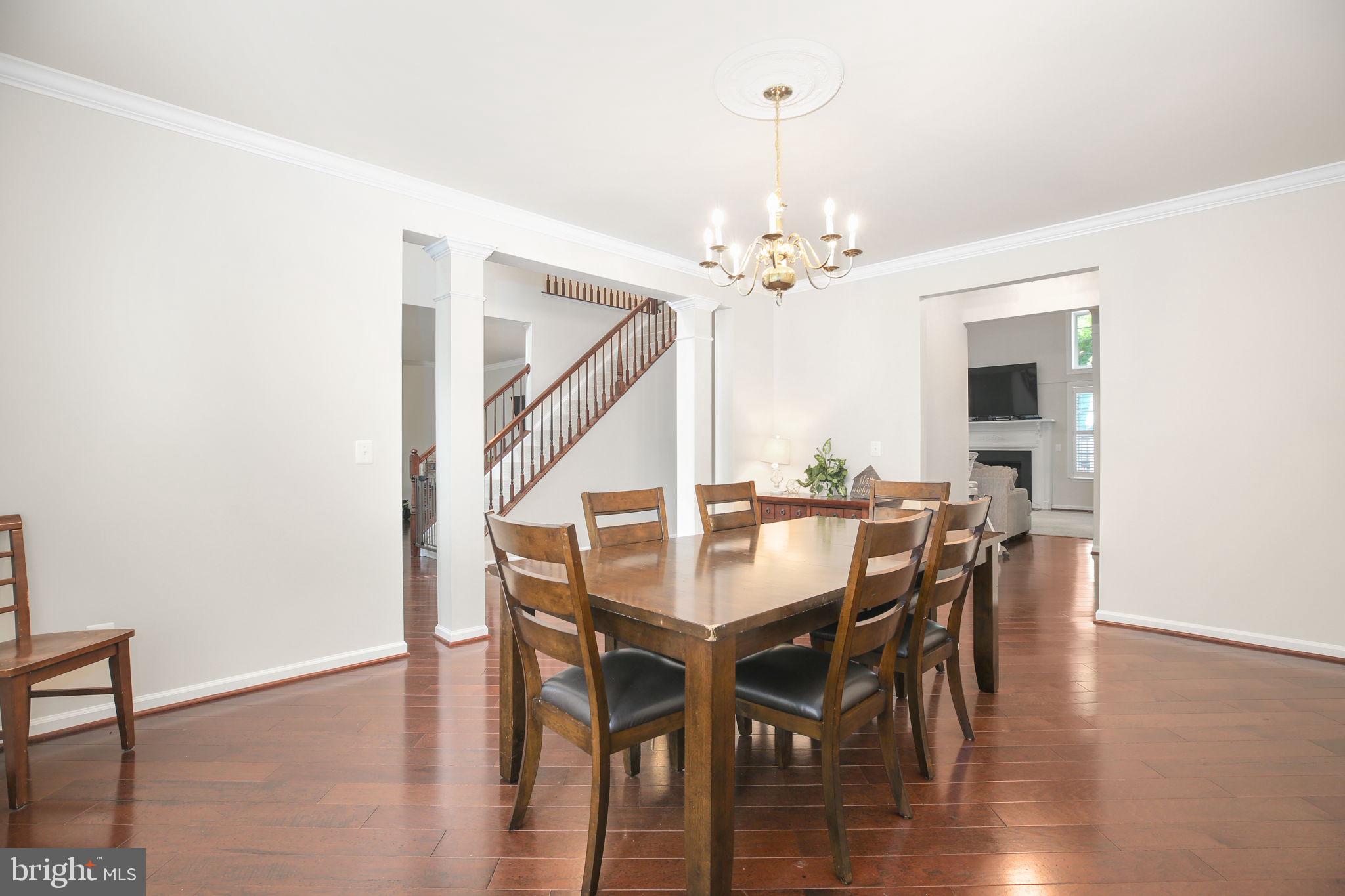 10108 Willow Ridge Lane Spotsylvania, VA 22553 - Photo 23 of 61 a view of a dining room with furniture and wooden floor