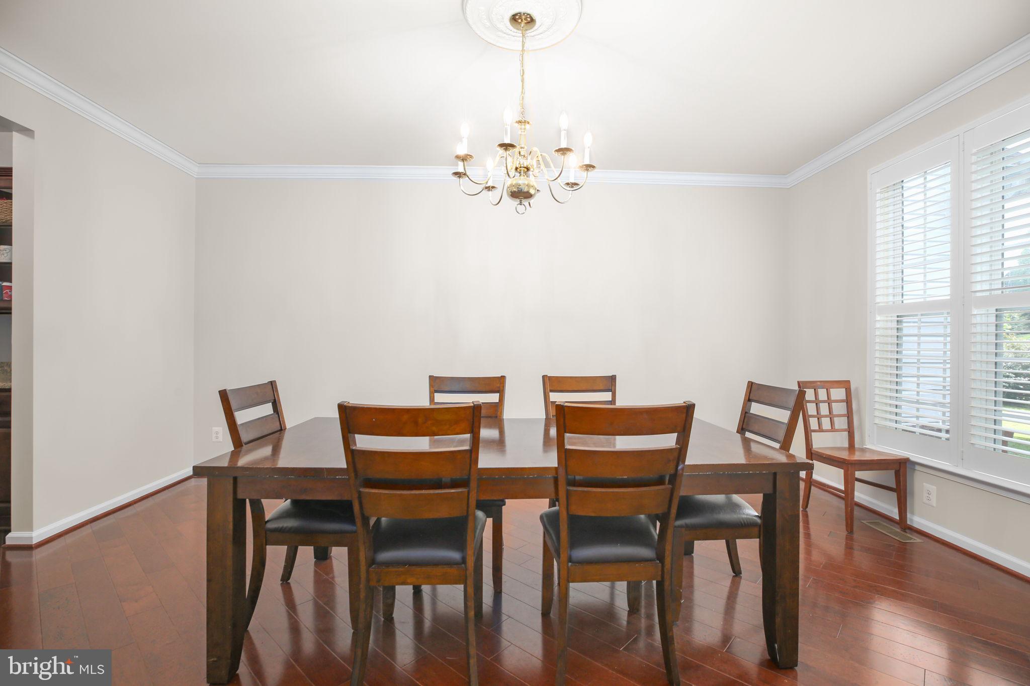 10108 Willow Ridge Lane Spotsylvania, VA 22553 - Photo 24 of 61 a view of a dining room with furniture window and wooden floor