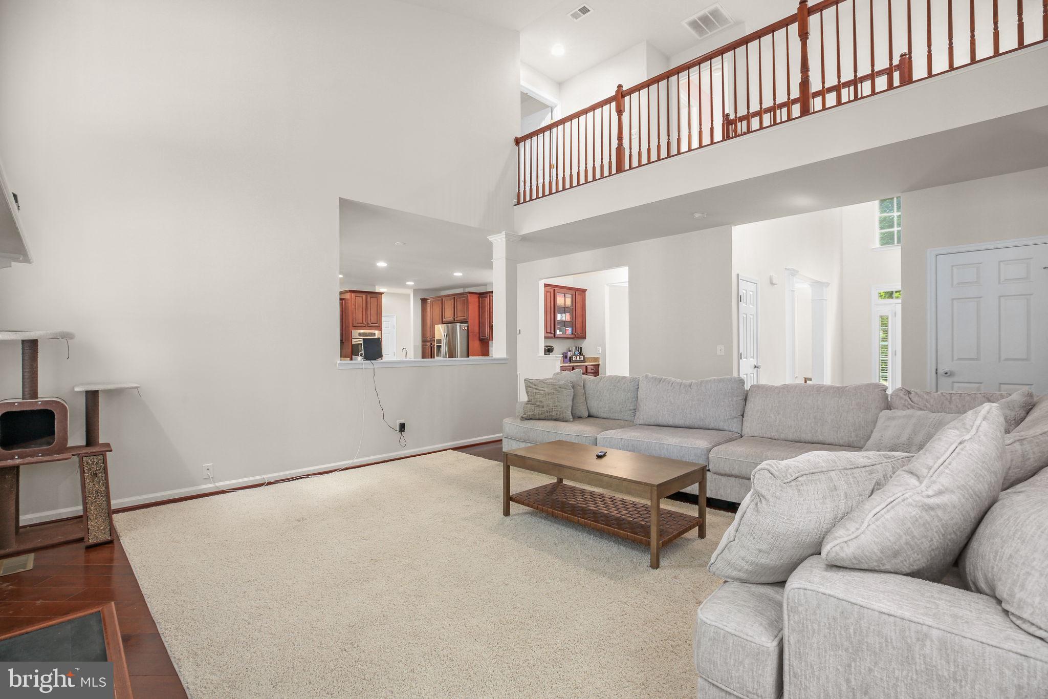 10108 Willow Ridge Lane Spotsylvania, VA 22553 - Photo 26 of 61 a living room with furniture and a large window