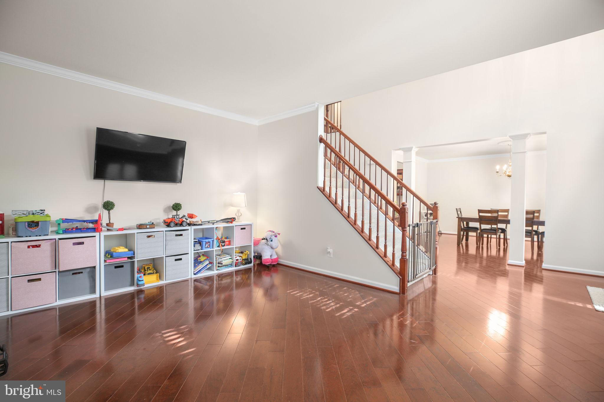 10108 Willow Ridge Lane Spotsylvania, VA 22553 - Photo 32 of 61 a view of a livingroom with furniture hardwood floor and a flat screen tv