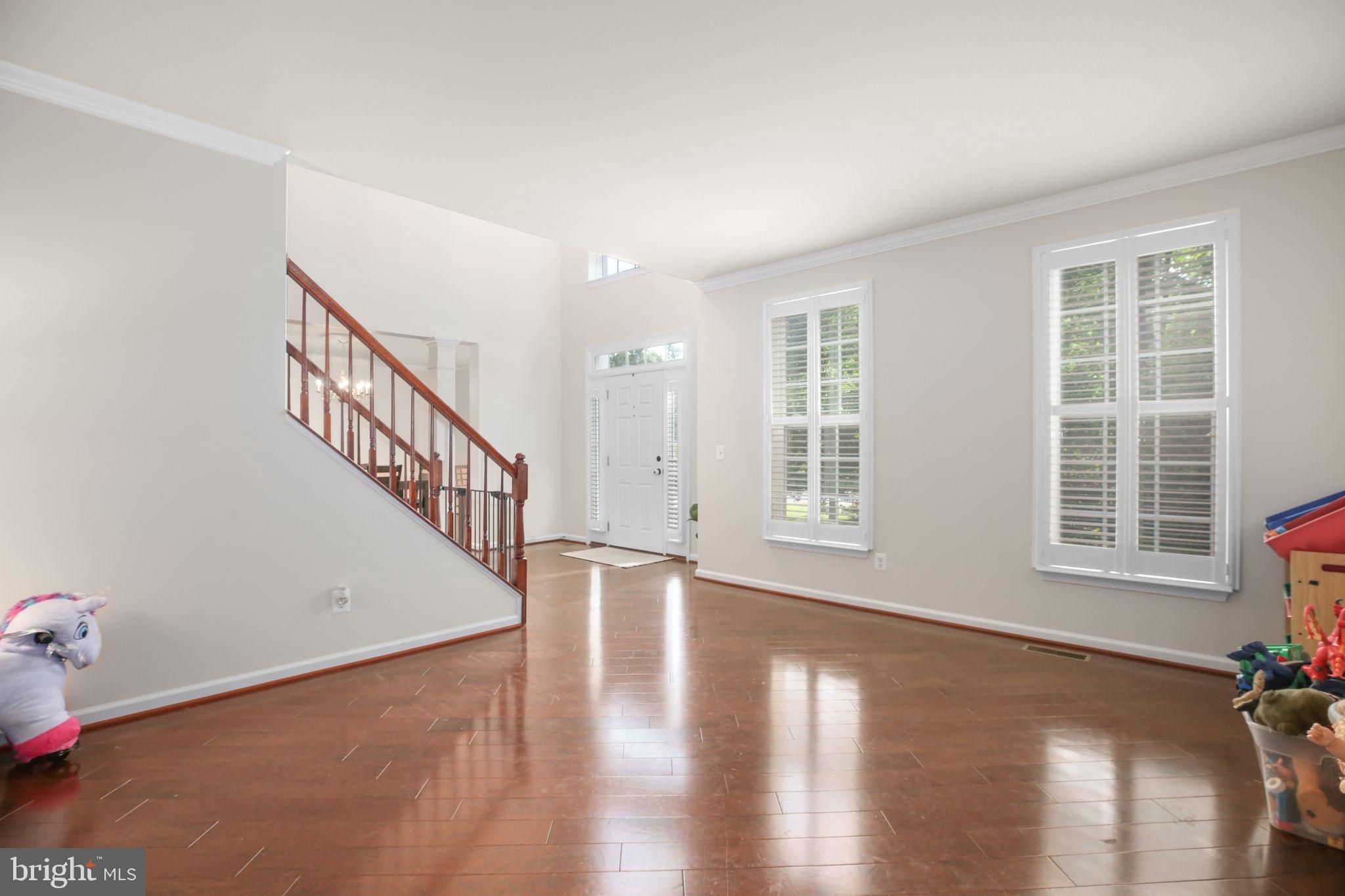 10108 Willow Ridge Lane Spotsylvania, VA 22553 - Photo 34 of 61 a view of an entryway with wooden floor and stairs