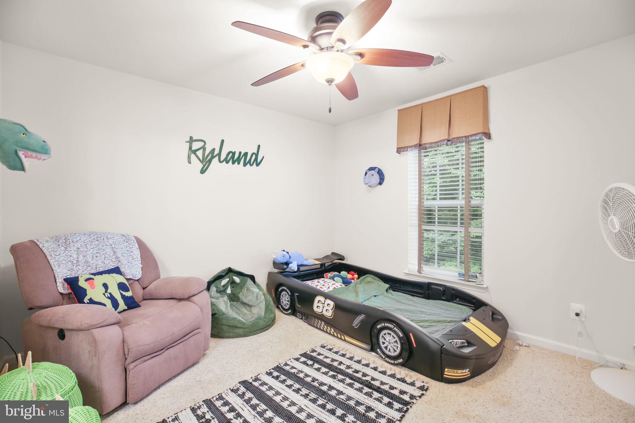 10108 Willow Ridge Lane Spotsylvania, VA 22553 - Photo 42 of 61 a living room with furniture a window and a chandelier
