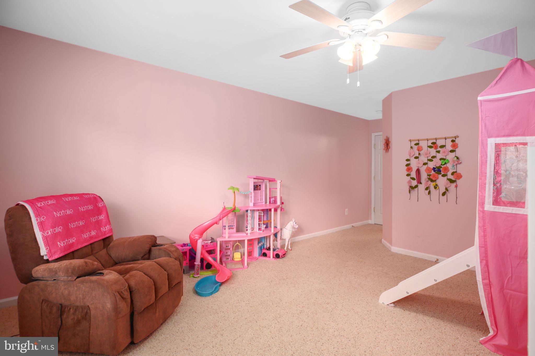 10108 Willow Ridge Lane Spotsylvania, VA 22553 - Photo 52 of 61 a bedroom with furniture and a couch