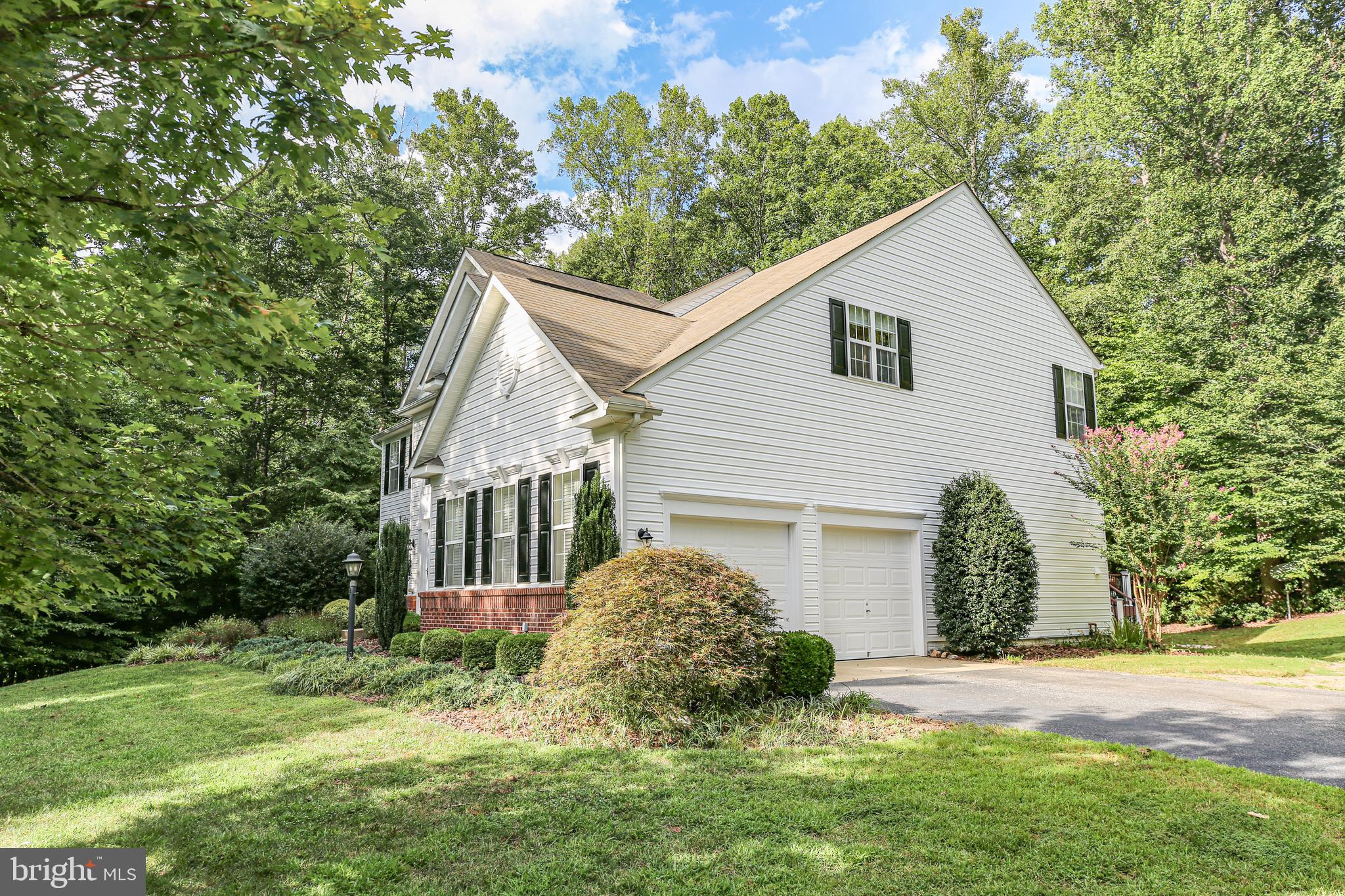 10108 Willow Ridge Lane Spotsylvania, VA 22553 - Photo 6 of 61 a view of a house with yard and a garden