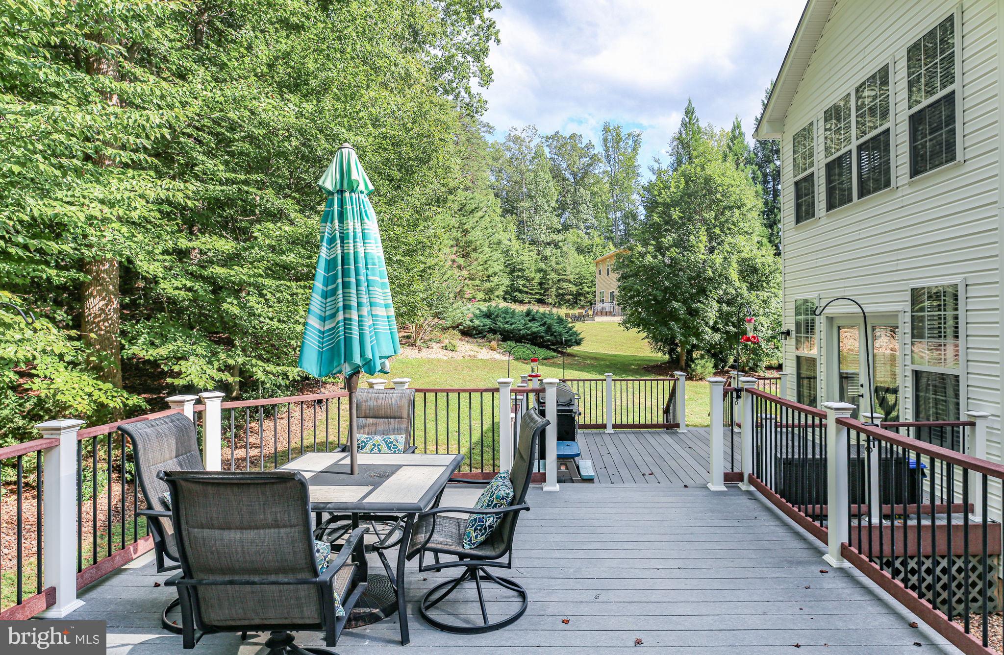 10108 Willow Ridge Lane Spotsylvania, VA 22553 - Photo 10 of 61 a view of a chairs and table in the balcony