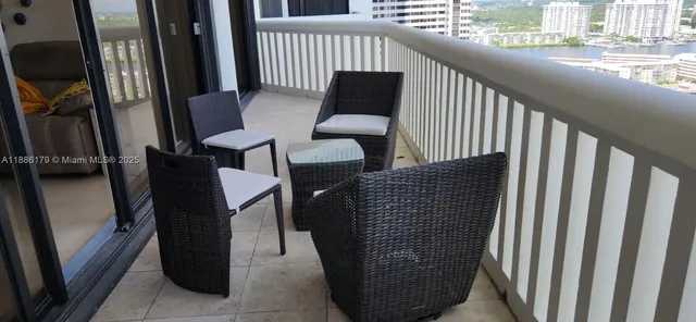 a view of balcony and wooden floor