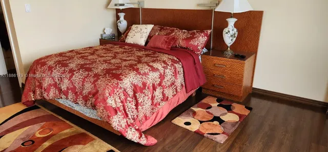 a bed sitting in a bedroom next to a small yard