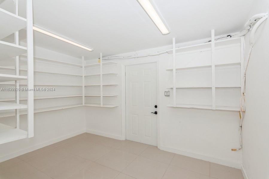 7772 Southwest 106th Terrace Pinecrest, FL 33156 - Photo 6 of 24 a view of an empty walk in closet