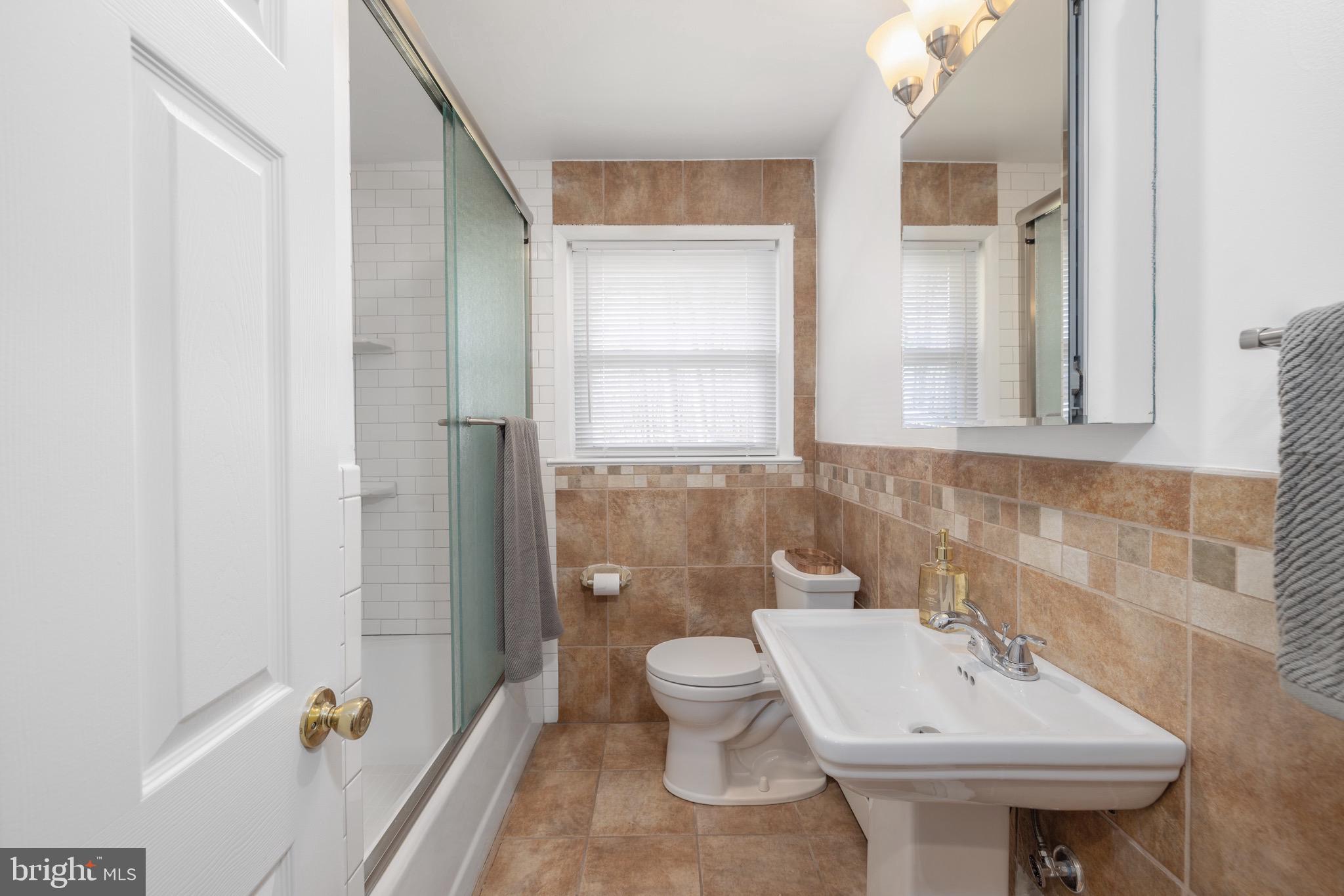 1707 Becker Road Green Lane, PA 18054 - Photo 16 of 41 main bath with rain shower head and subway tiles