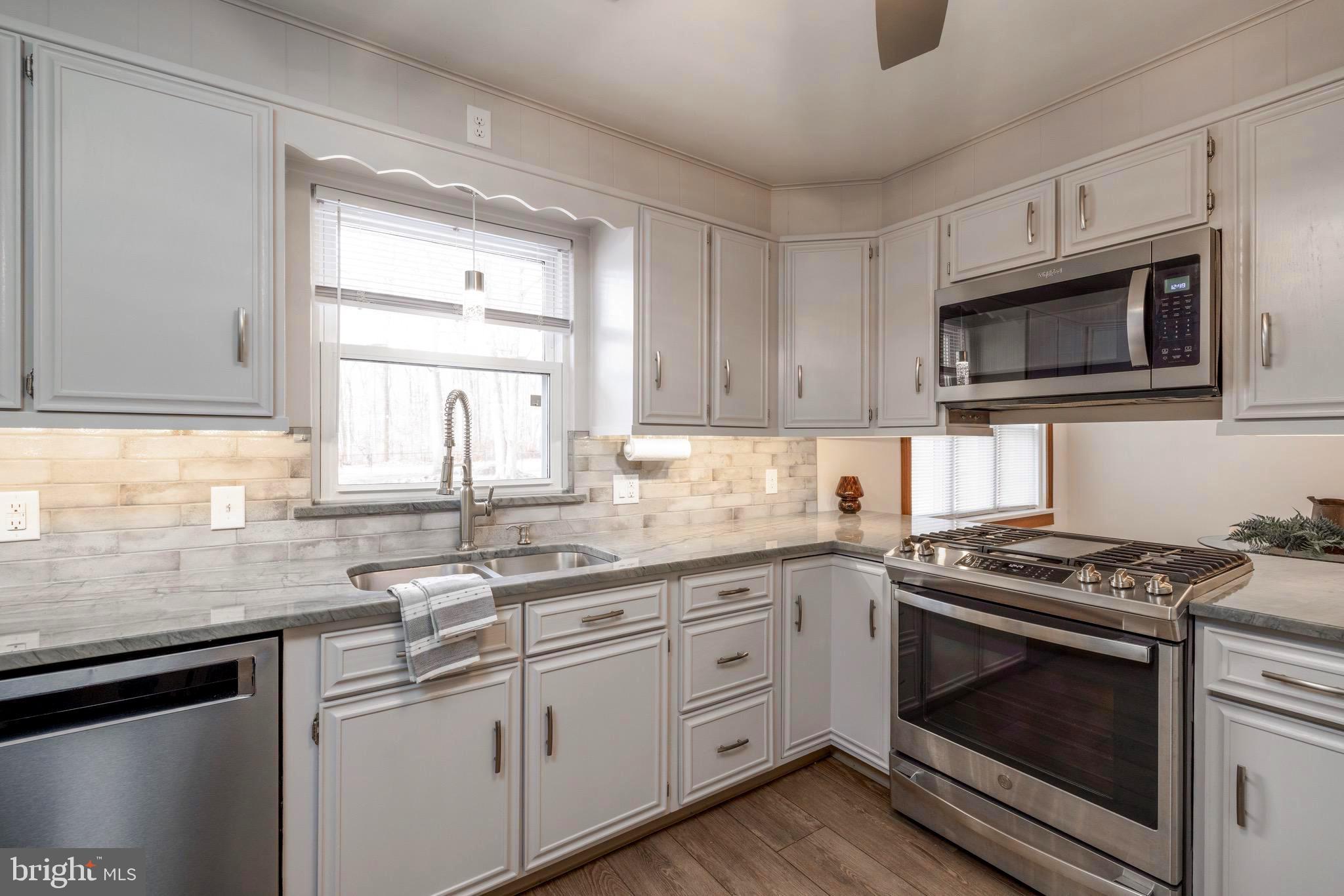 Updated kitchen with granite & subway tiles