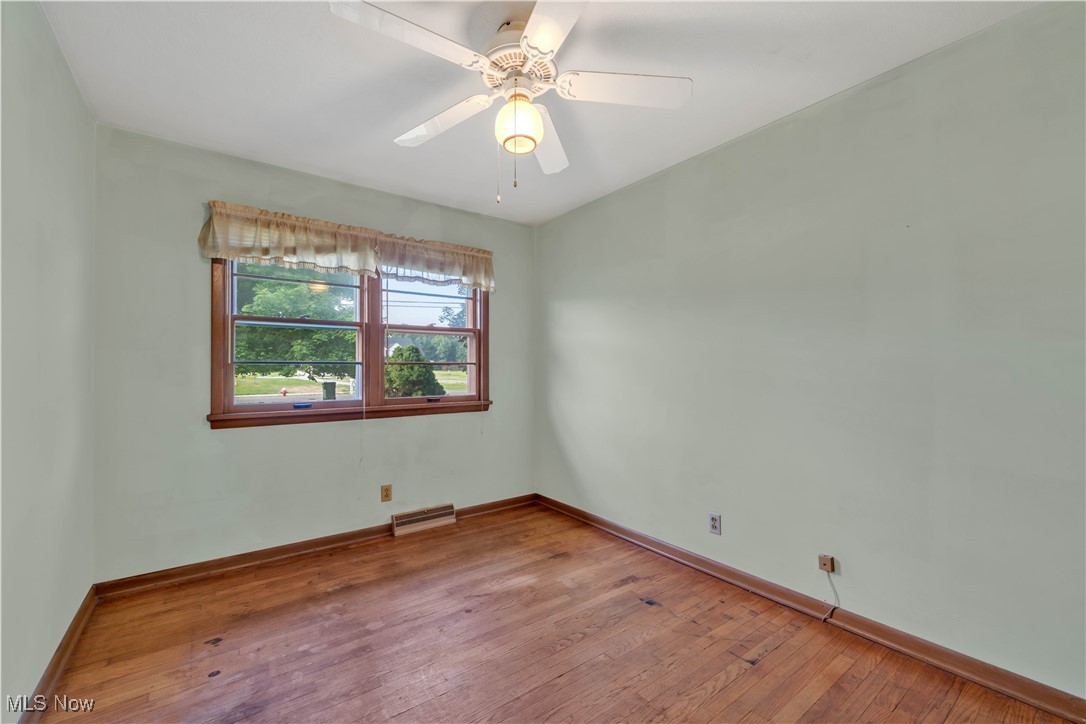 38450 Otten Road North Ridgeville, OH 44039 - Photo 28 of 45 Unfurnished room with light wood finished floors and ceiling fan