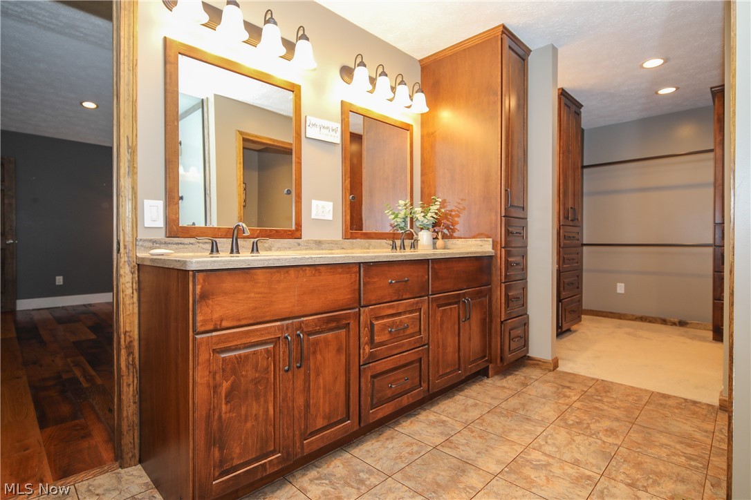 38610 Spiedel Town Road Bethesda, OH 43719 - Photo 22 of 33 Bathroom with tile patterned floors and double vanity