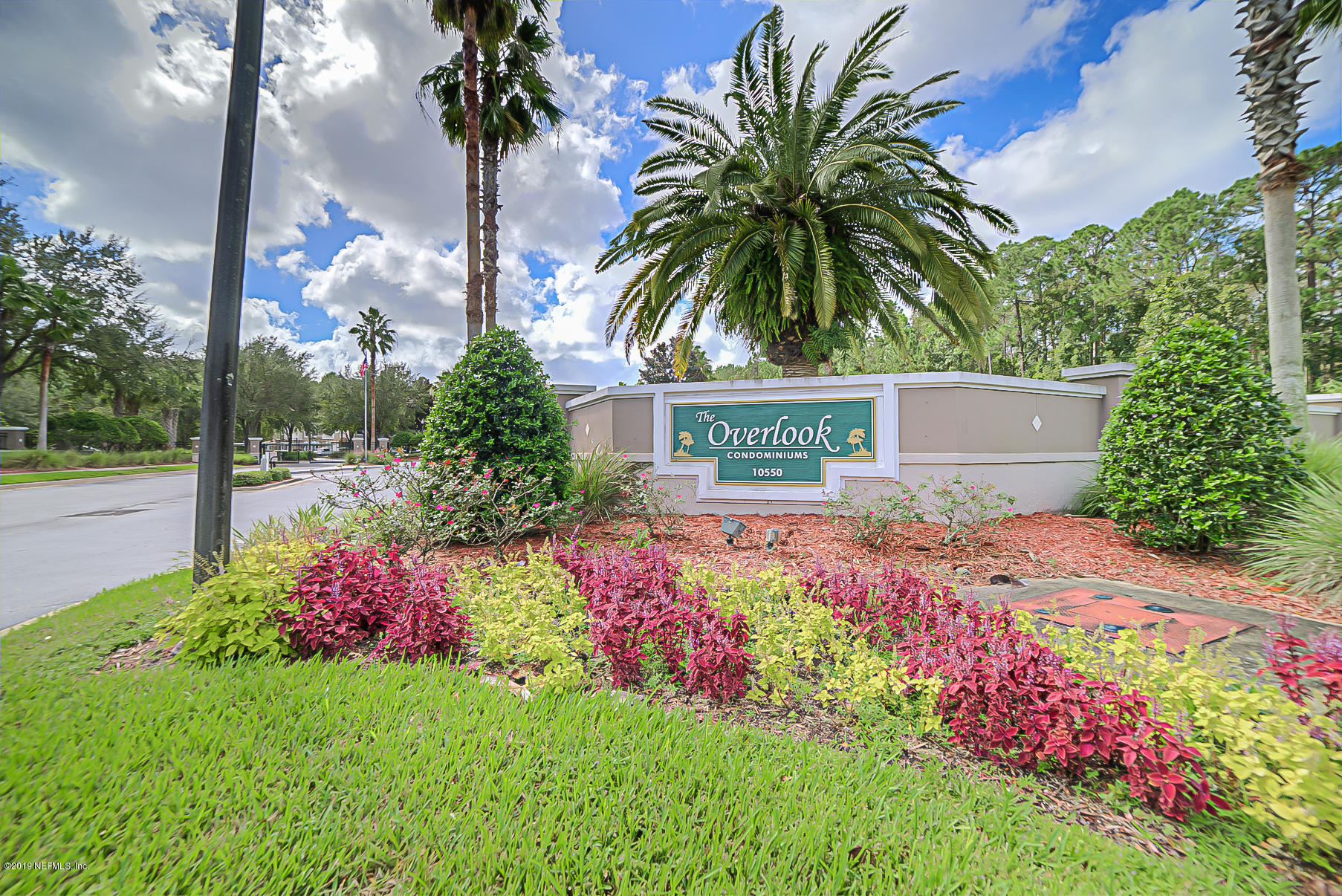 10550 Baymeadows Road, Unit 1023 Jacksonville, FL 32256 - Photo 1 of 42 a view of a house with a yard and garden