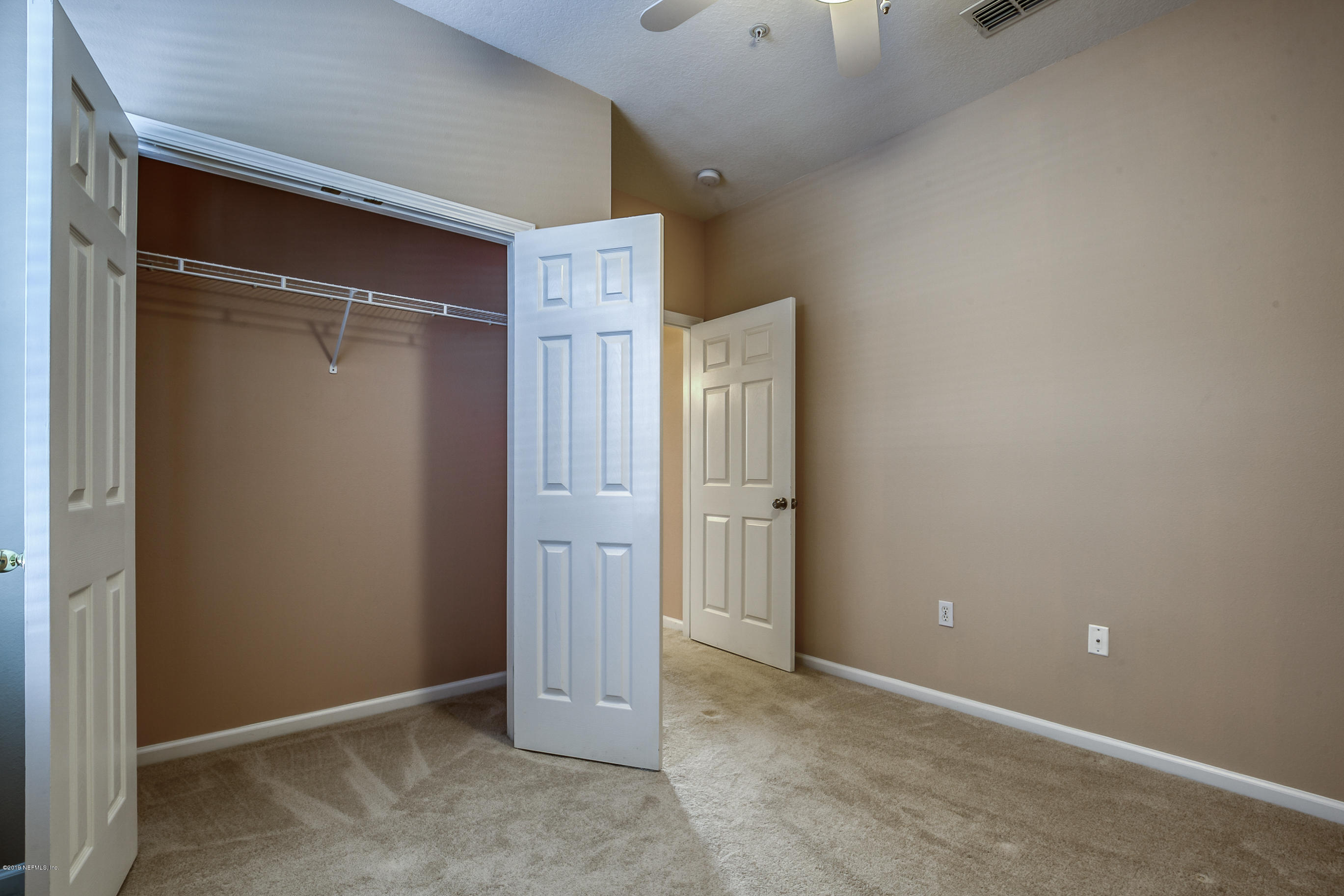 10550 Baymeadows Road, Unit 1023 Jacksonville, FL 32256 - Photo 14 of 42 an empty room with closet