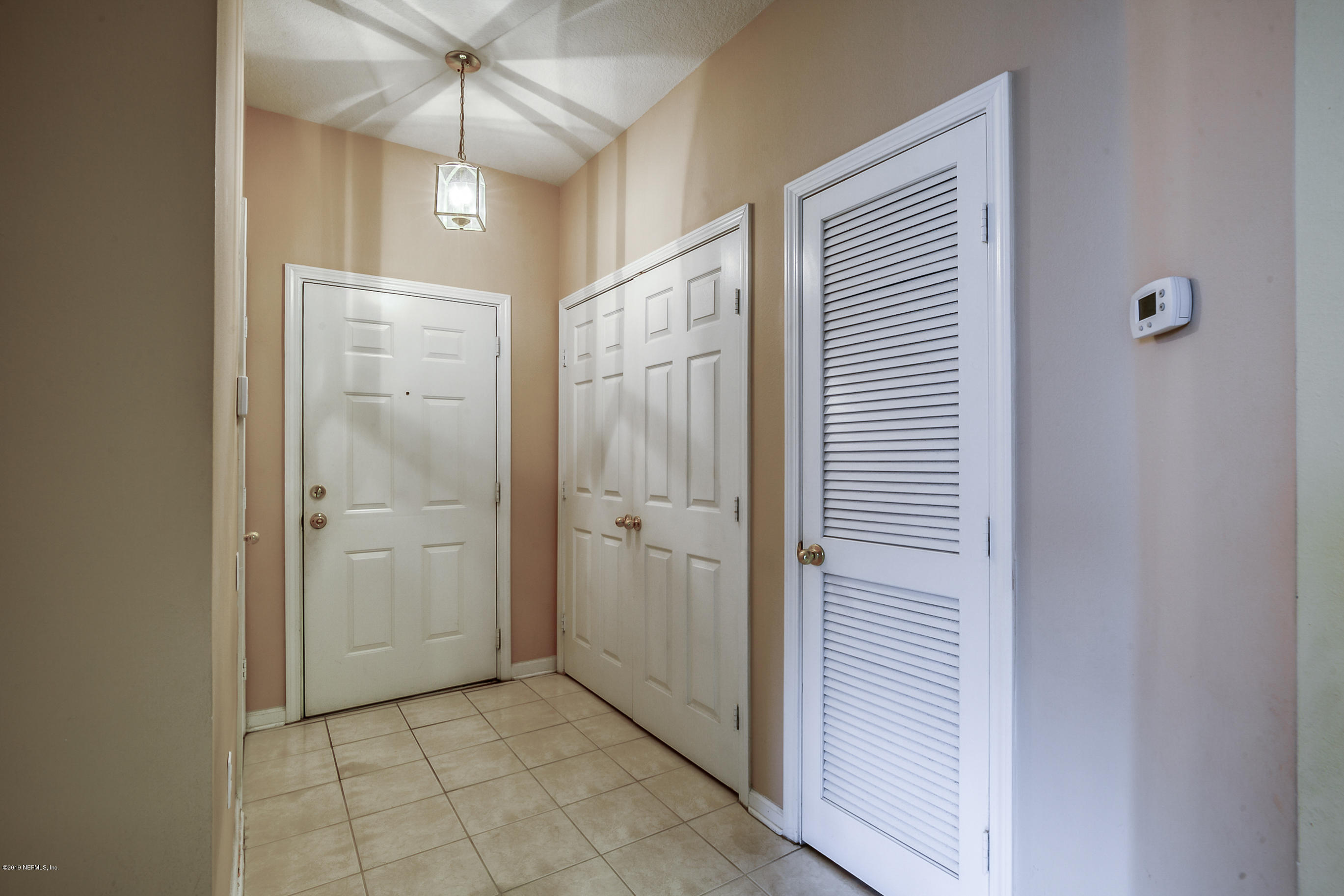 10550 Baymeadows Road, Unit 1023 Jacksonville, FL 32256 - Photo 17 of 42 a view of a bathroom with a shower and a sink