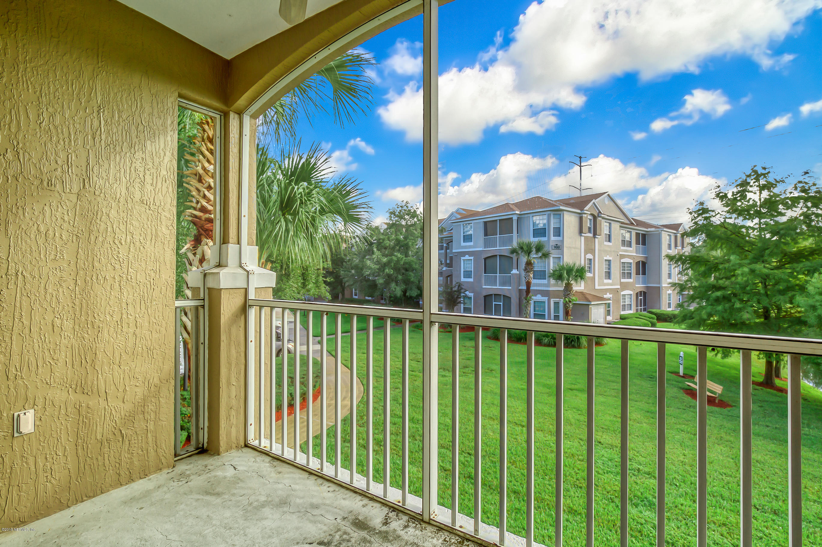10550 Baymeadows Road, Unit 1023 Jacksonville, FL 32256 - Photo 23 of 42 a view of a house with a swimming pool from a balcony