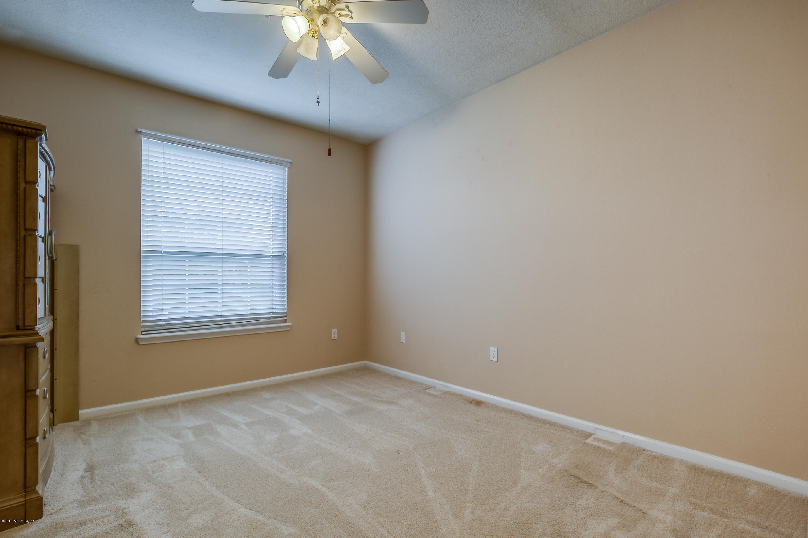 10550 Baymeadows Road, Unit 1023 Jacksonville, FL 32256 - Photo 8 of 42 an empty room with a window