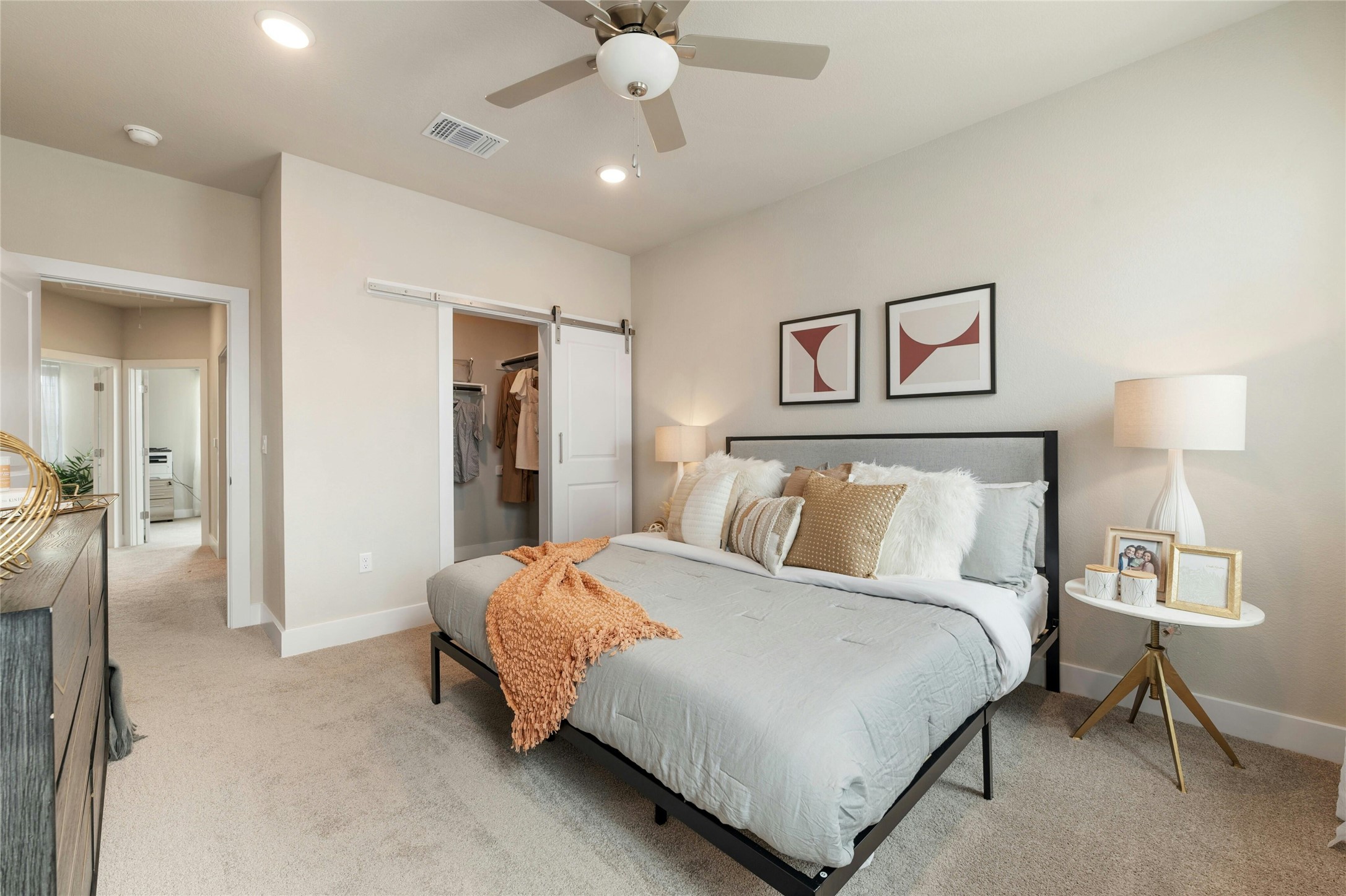 5804 Rotunda View Austin, TX 78747 - Photo 12 of 27 Relax in this well-lit bedroom featuring a convenient sliding barn door closet and plush carpeting.