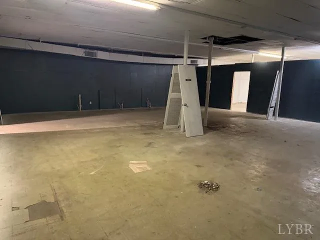 a view of an empty room with stairs