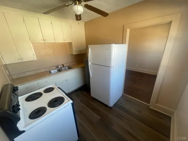 a view of staircase with white walls and windows