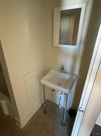 a bathroom with a sink and mirror