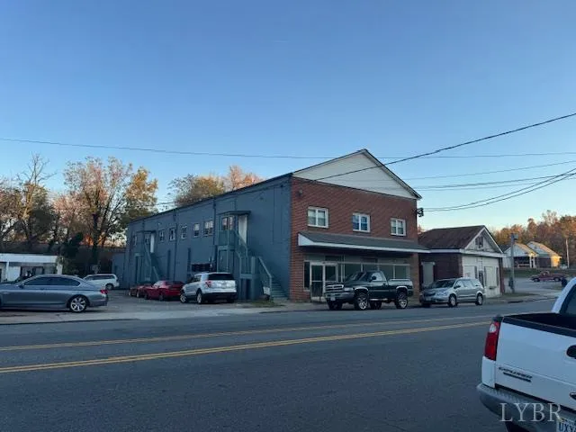 a view of a car parked on the side of a street
