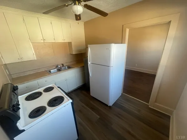 a view of staircase with white walls and windows