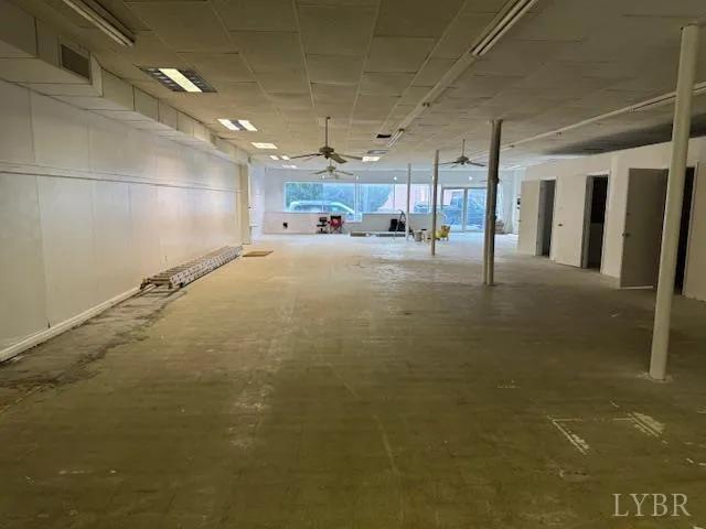 a view of a hallway with wooden shelves