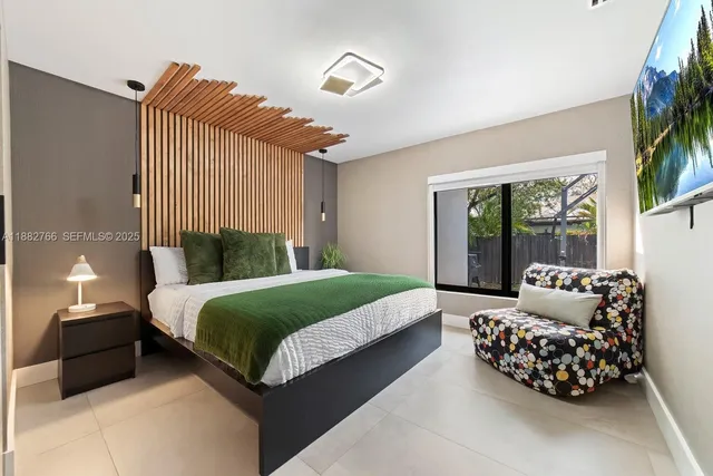 a bedroom with a bed and a couch