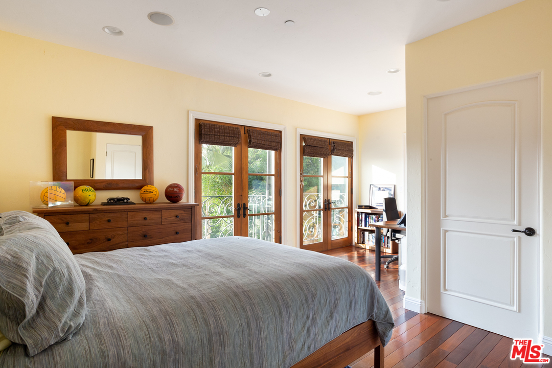 3110 Benedict Canyon Drive Beverly Hills, CA 90210 - Photo 25 of 45 a bed room with a bed and a large window