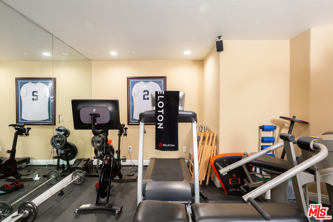 3110 Benedict Canyon Drive Beverly Hills, CA 90210 - Photo 35 of 45 a view of a room with gym equipment