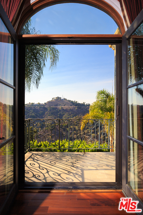 3110 Benedict Canyon Drive Beverly Hills, CA 90210 - Photo 9 of 45 a view of a two door of the house