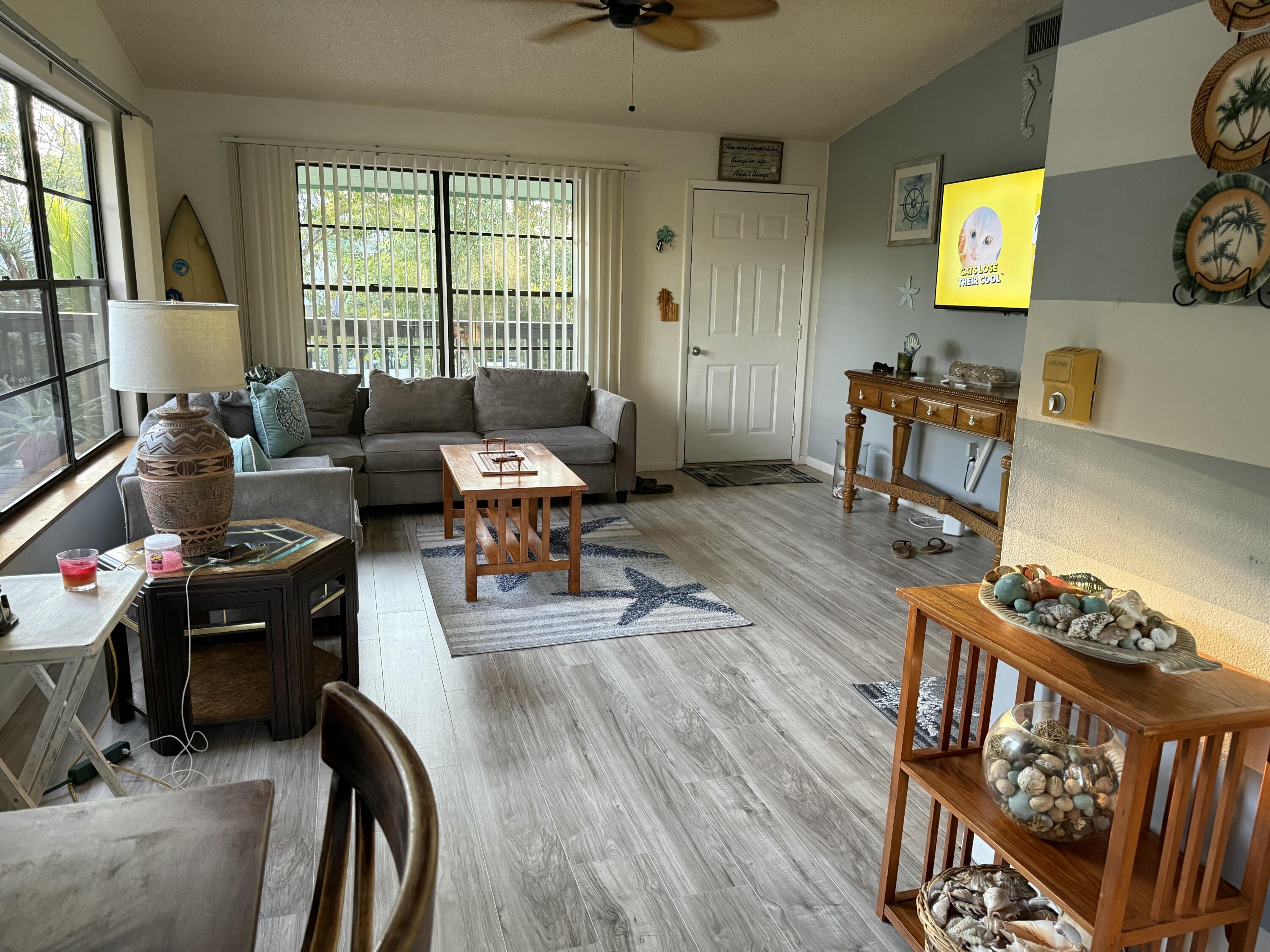 760 Musa Drive Key Largo, FL 33037 - Photo 16 of 20 a living room with furniture and a flat screen tv