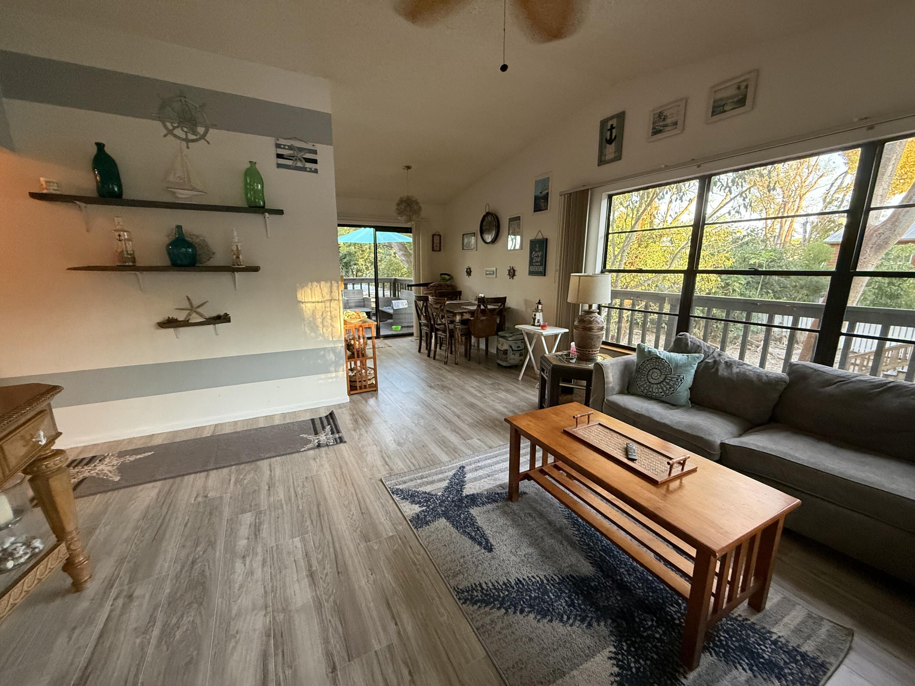 760 Musa Drive Key Largo, FL 33037 - Photo 17 of 20 a living room with furniture and a wooden floor