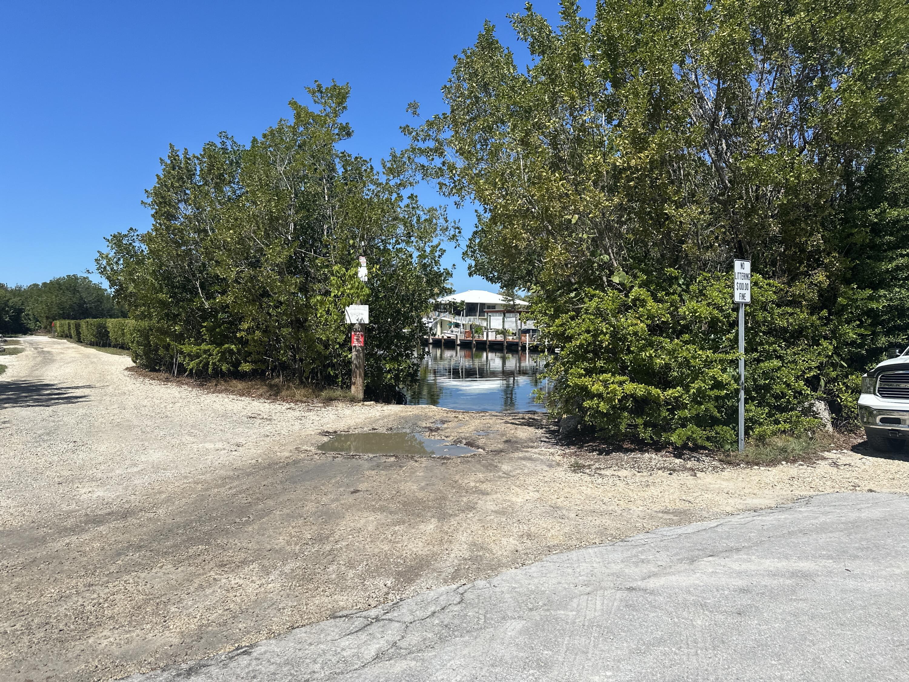 760 Musa Drive Key Largo, FL 33037 - Photo 7 of 20 a pathway of a house with a yard