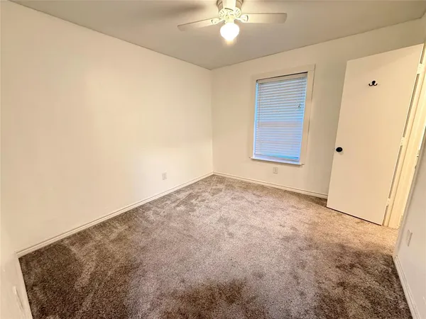 an empty room with a bathroom