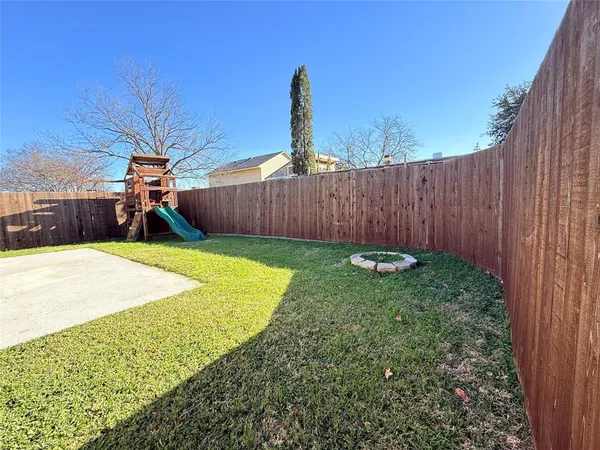 a backyard of a house with a garden