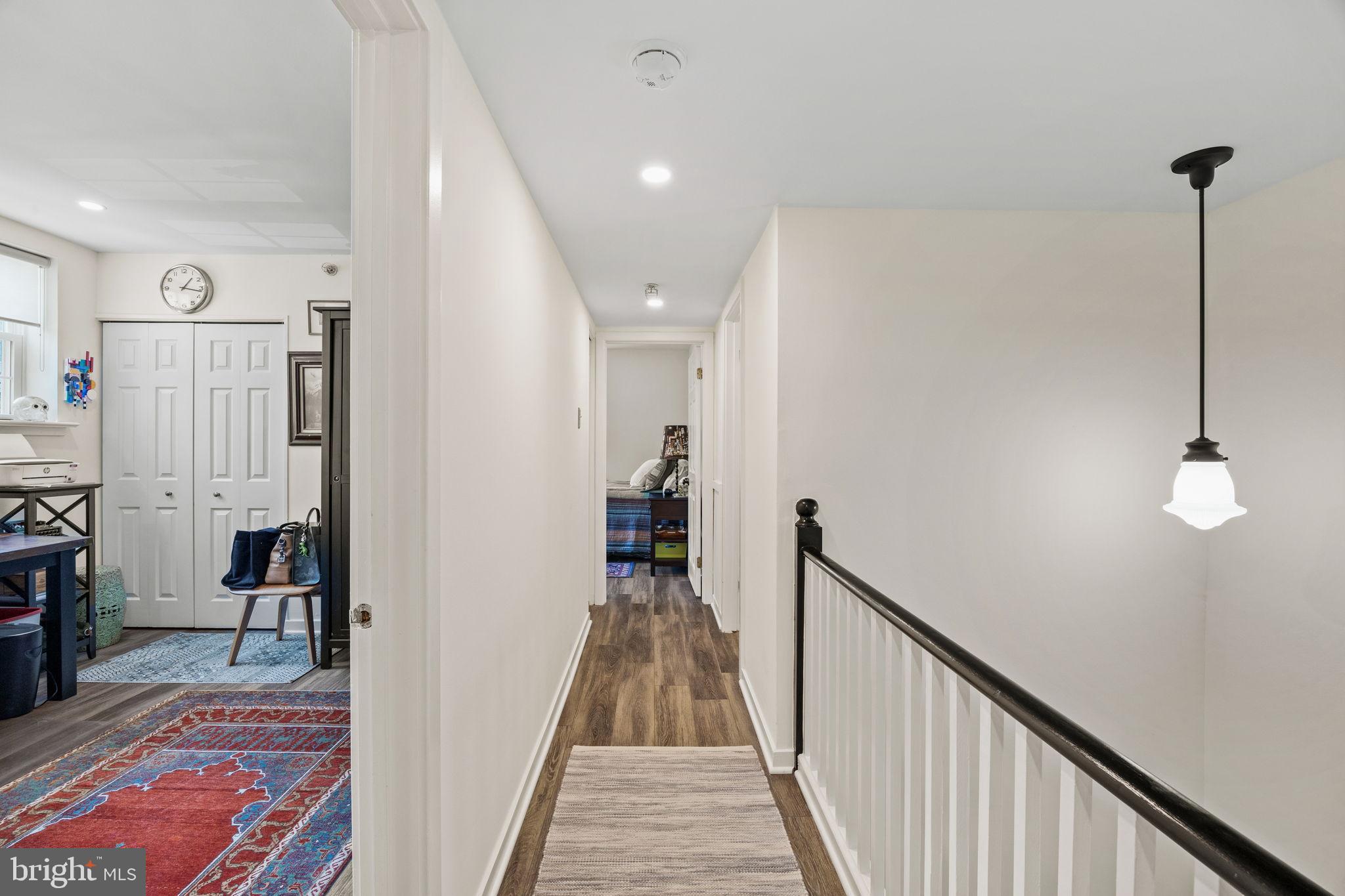 104 Woodside Road, Unit B106 Haverford, PA 19041 - Photo 15 of 31 a view of a hallway with wooden floor and stairs