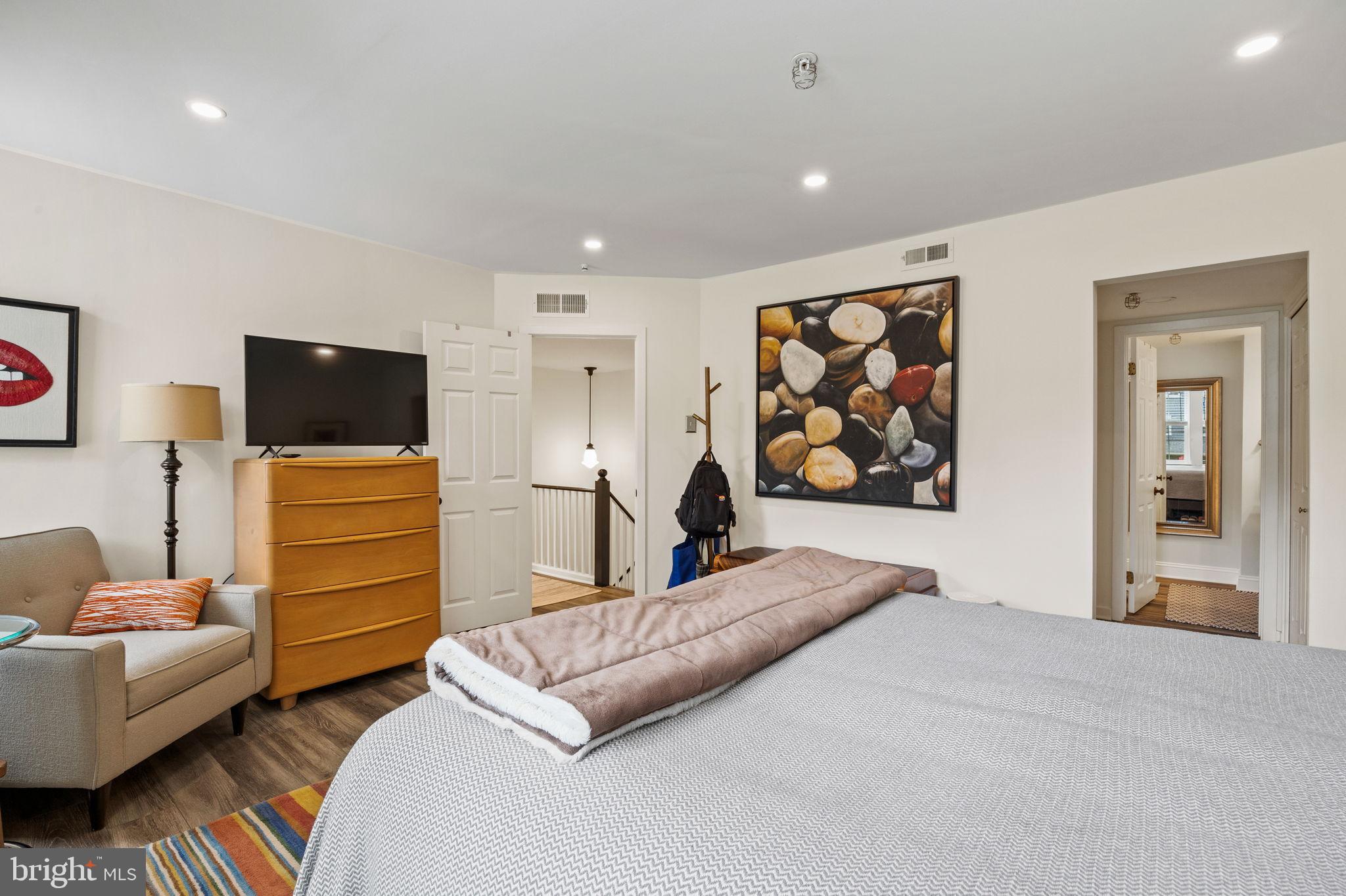 104 Woodside Road, Unit B106 Haverford, PA 19041 - Photo 20 of 31 a spacious bedroom with a bed and couch