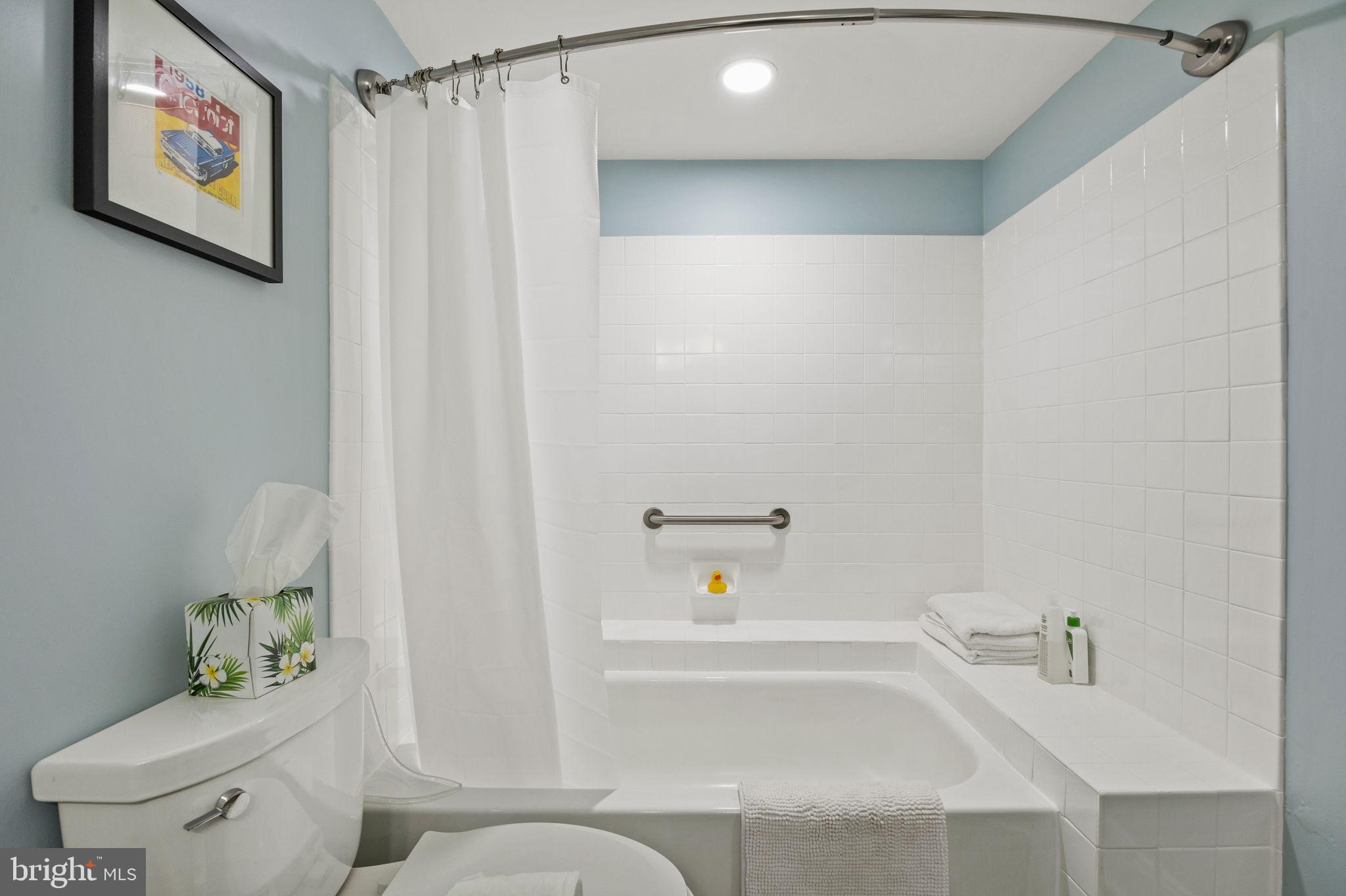104 Woodside Road, Unit B106 Haverford, PA 19041 - Photo 24 of 31 a bathroom with a bathtub and a shower