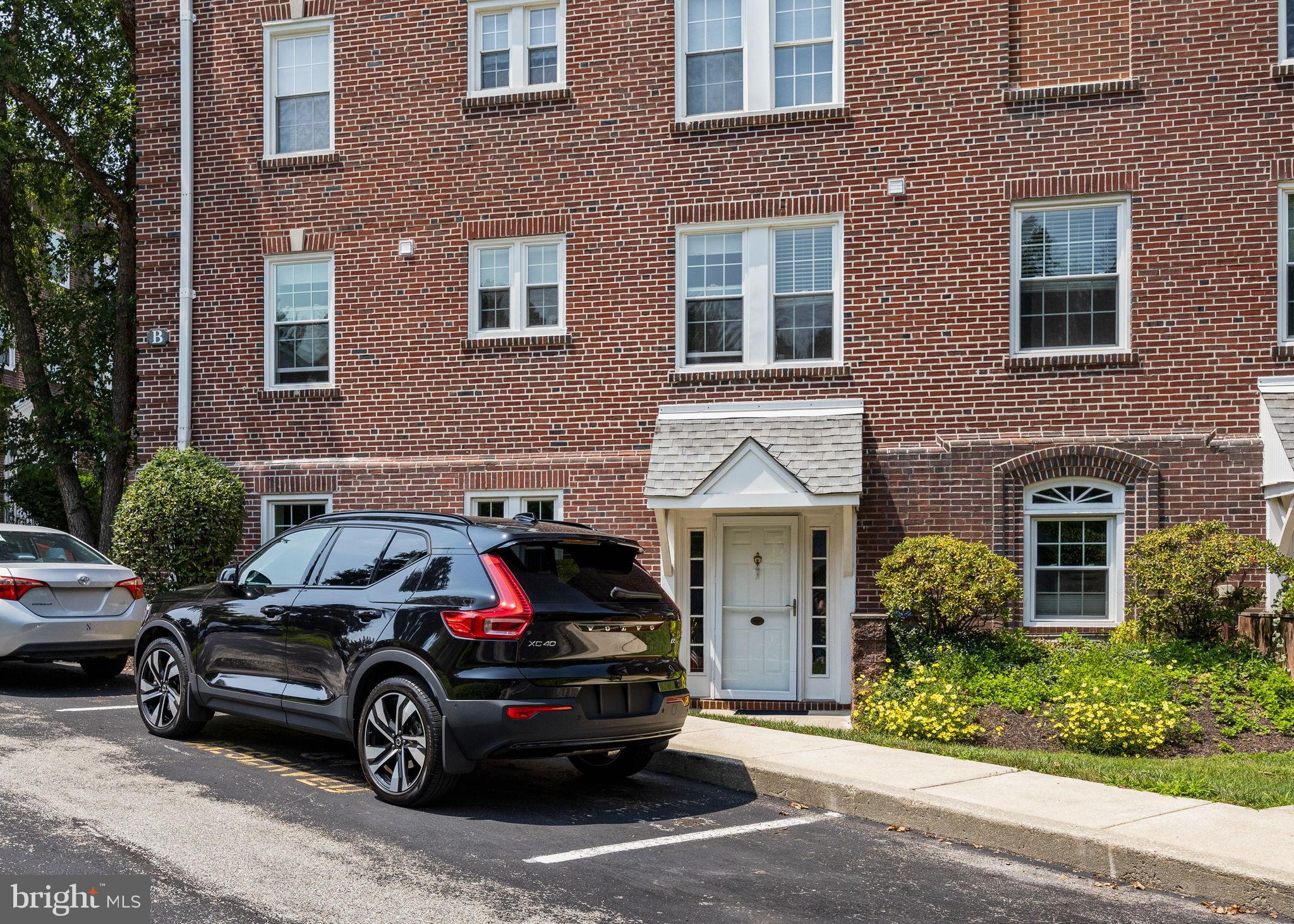 104 Woodside Road, Unit B106 Haverford, PA 19041 - Photo 28 of 31 a car parked in front of a brick building