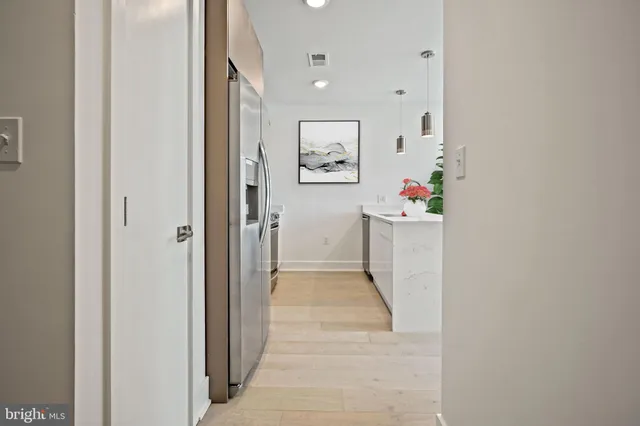 a view of an entryway with wooden floor
